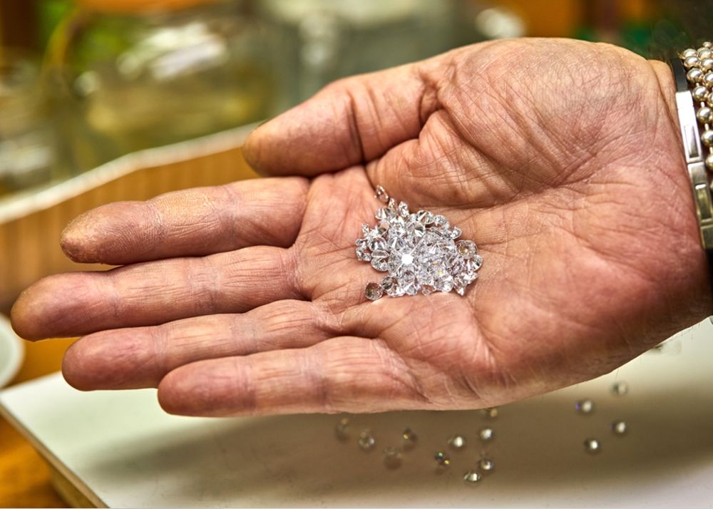 Hand holding diamonds